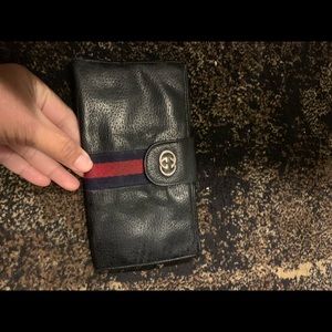 Gucci check book holder.